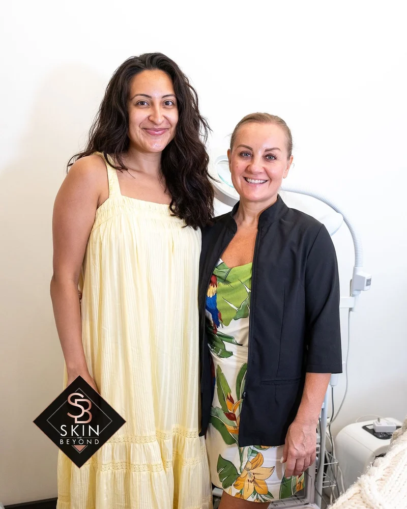 Client and esthetician smiling together at Skin and Beyond Spa in Chicago