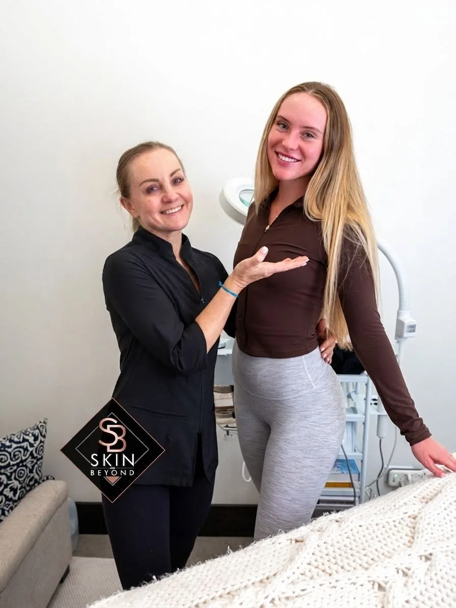 Esthetician with a client after a facial at Skin and Beyond Spa